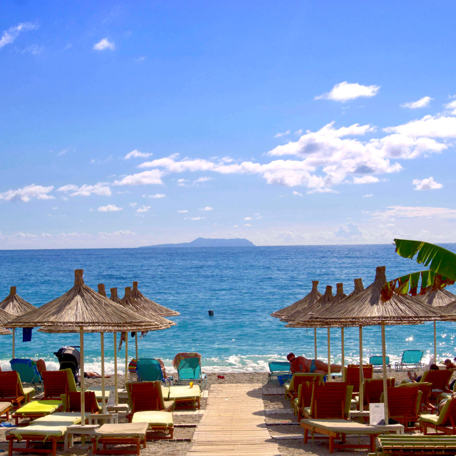 Albanian Riviera beach with sun umbrellas