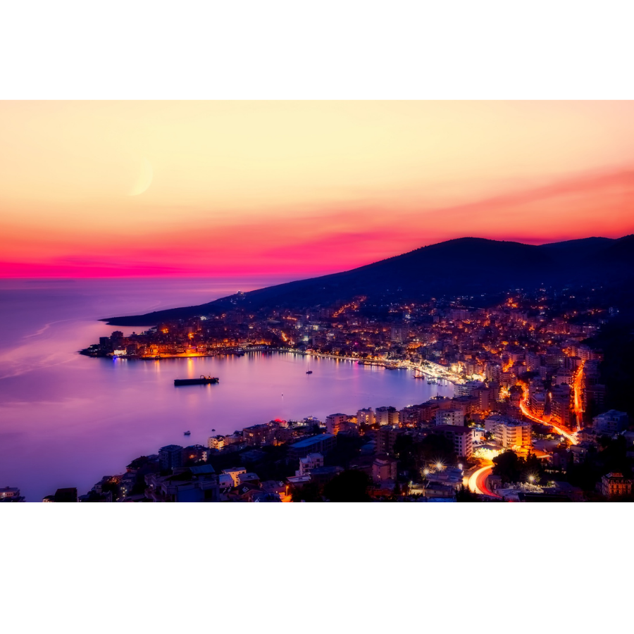 Sarandë coast at night with promenade lights reflecting on the bay